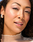 Model wearing Glowify Long-Lasting Eyeshadow Stick product shade Pink Luster.