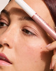 Model wearing Glowify Long-Lasting Eyeshadow Stick product shade Rose Mauve.