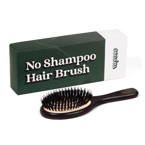 No Shampoo Hair Brush with black bristles beside a dark green packaging box