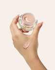 Under Eye Brightening Cream product shade Fair model hand.