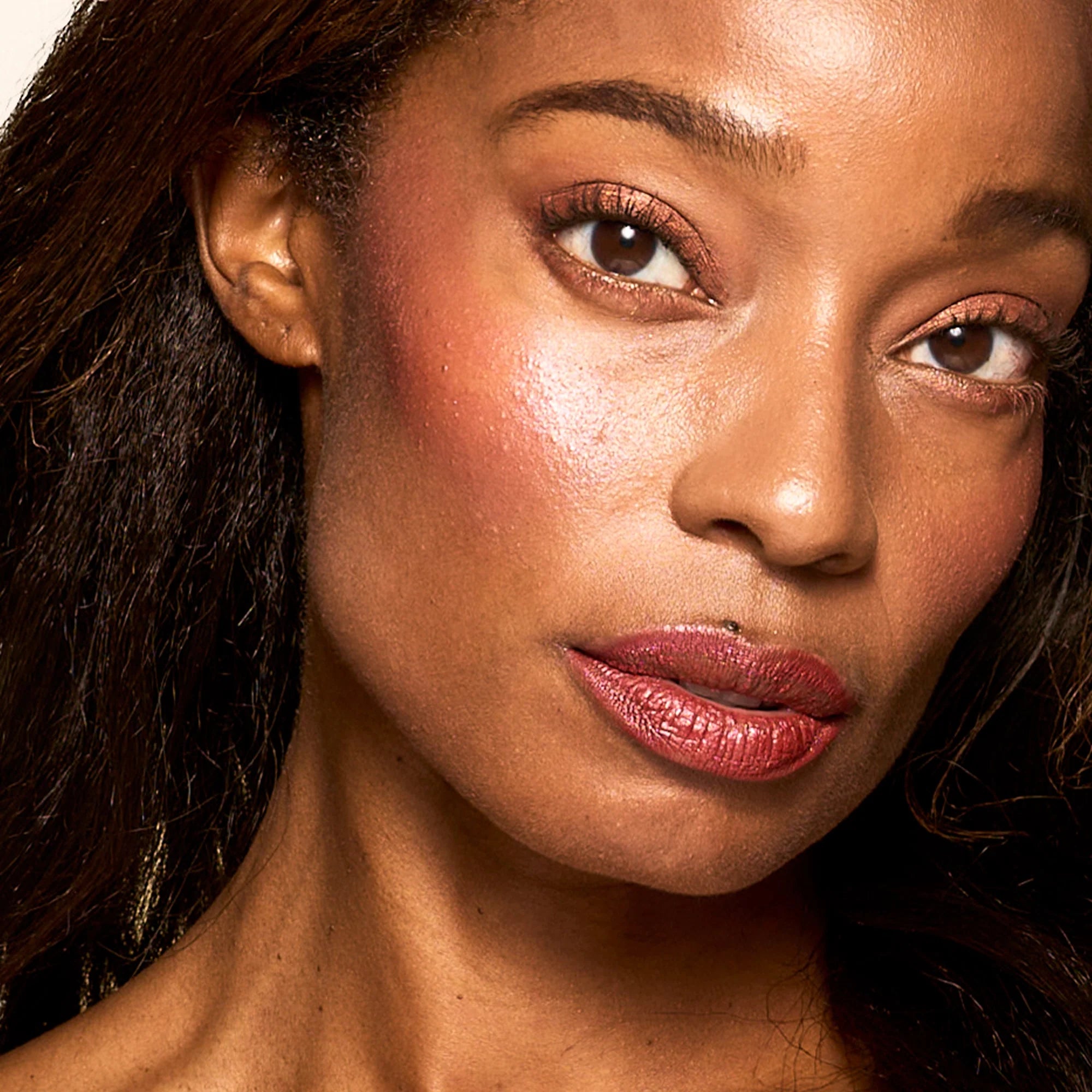 Model with Bouncy Mousse Multi-Use Pigment product shade Berry Whip.