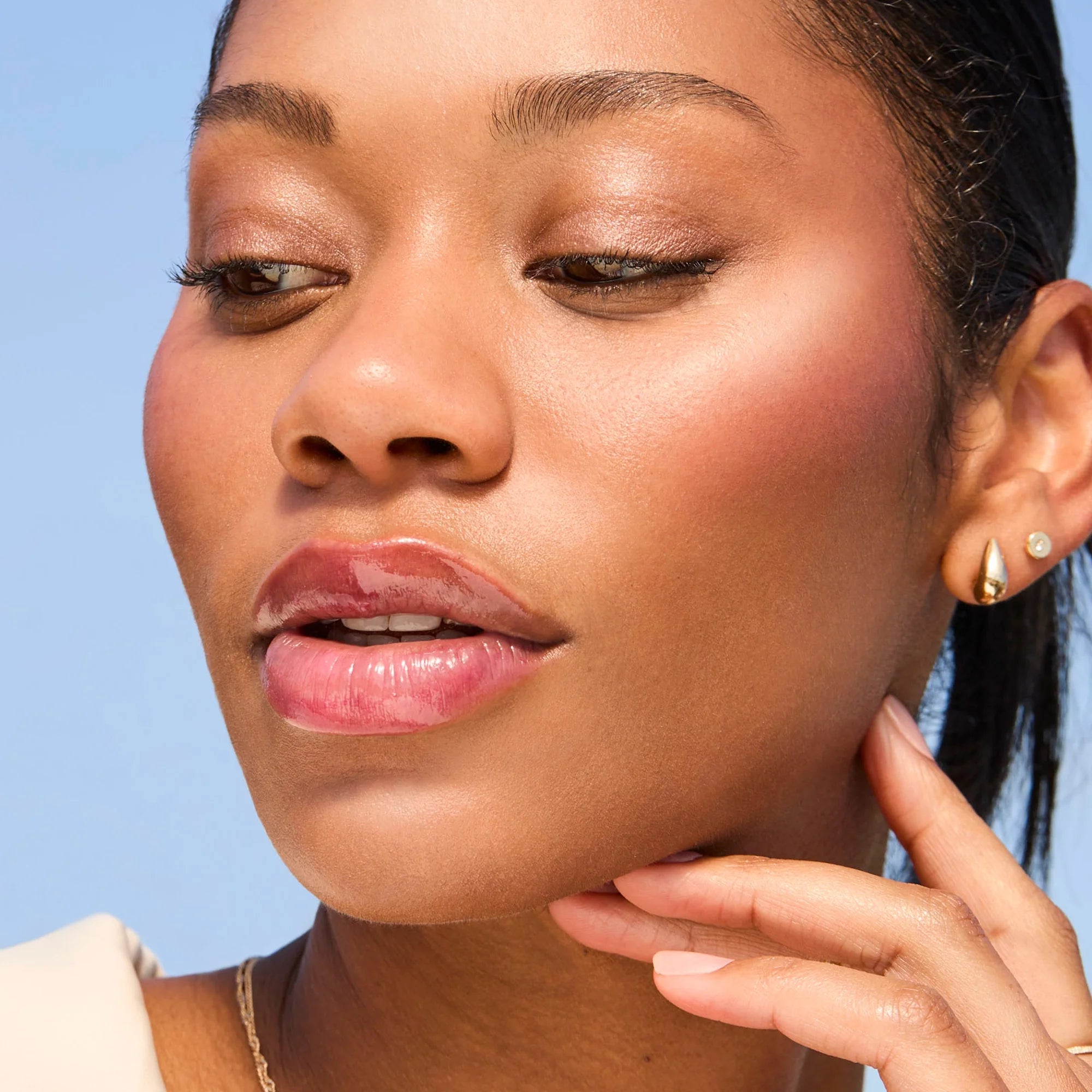 Model wearing Glowify Long-Lasting Eyeshadow Stick product shade Cocoa.