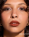 Model wearing Glowify Long-Lasting Eyeshadow Stick product shade Roasted Coffee.