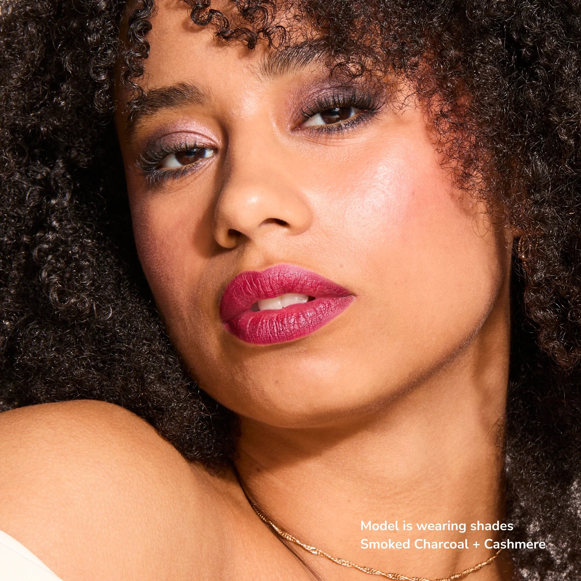Model wearing Glowify Long-Lasting Eyeshadow Stick product shade Smoked Charcoal.