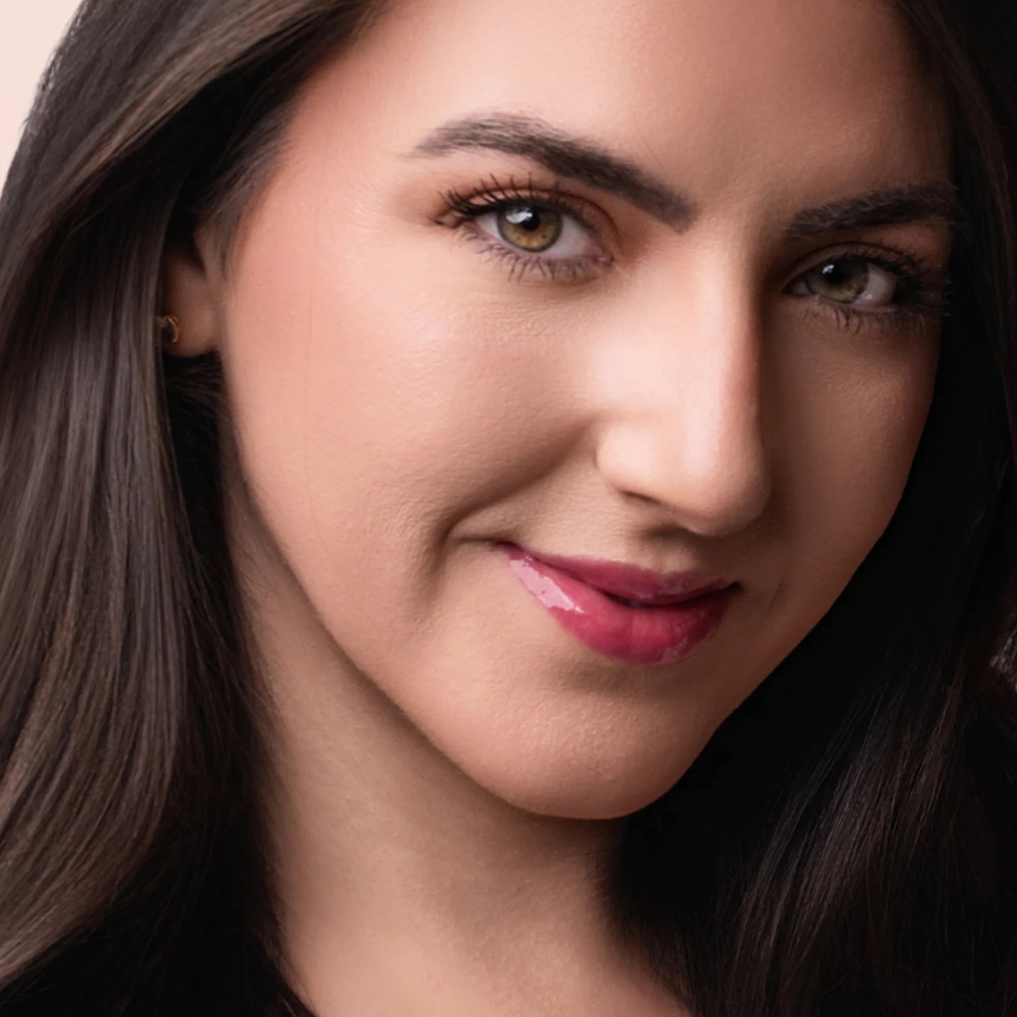 Model wearing Glowify Sheer Silk Lip Oil product shade Rose Water.