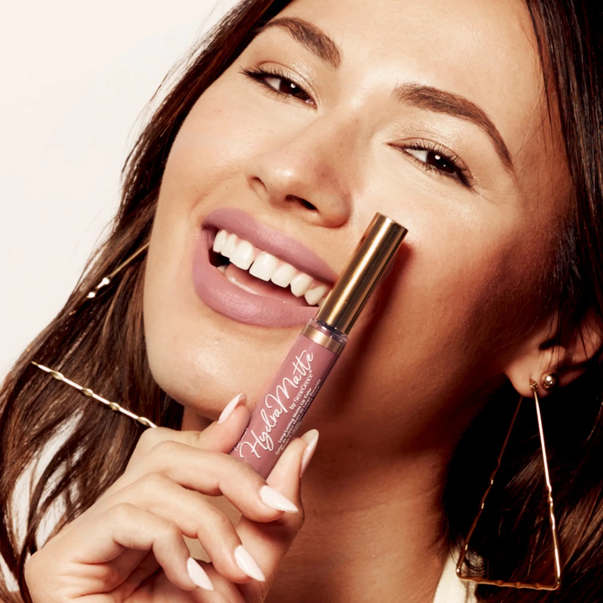 Model wearing LipSense Cream product shade Praline Rose.