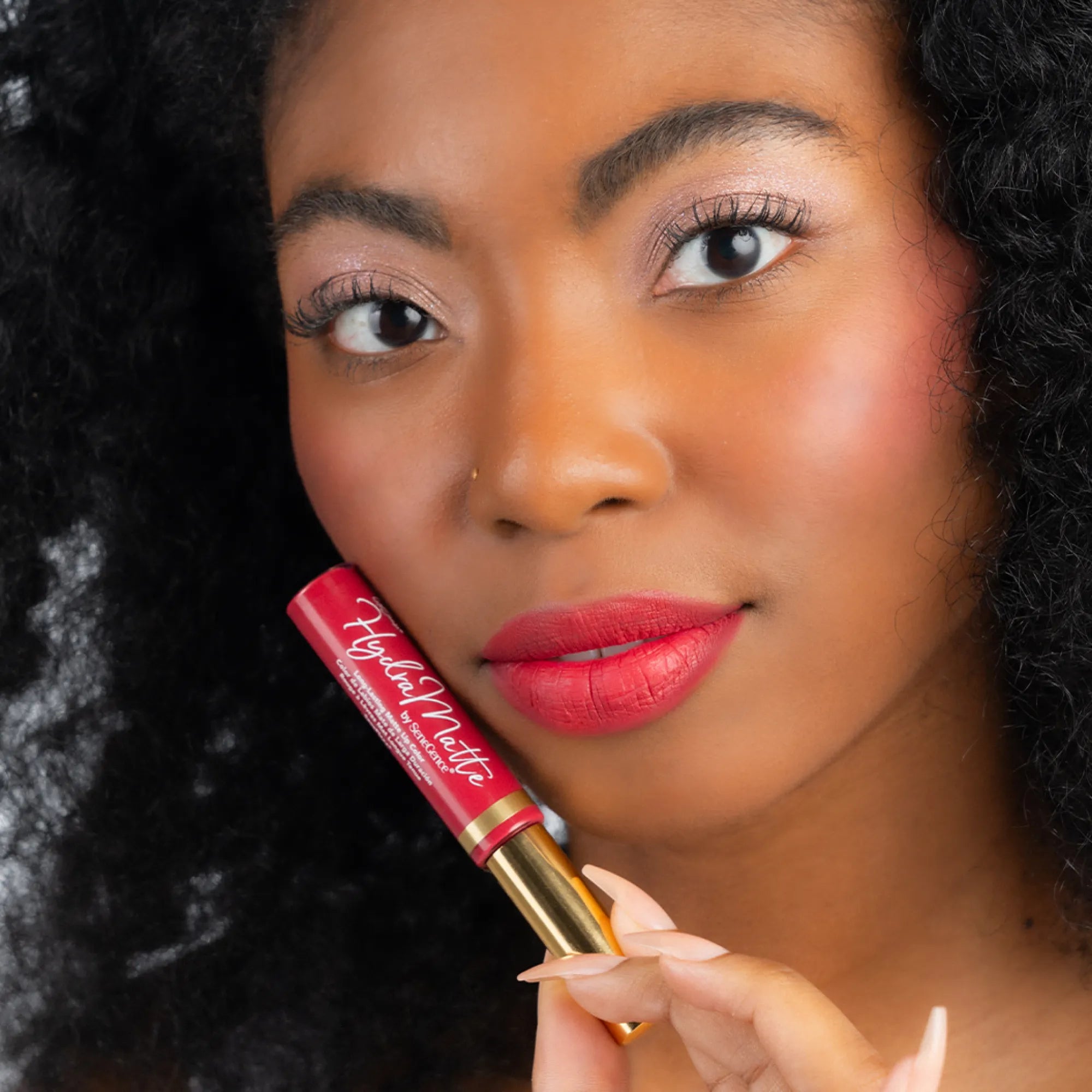 Model wearing LipSense Cream product shade Rich Ruby.