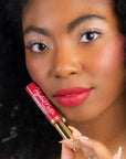 Model wearing LipSense Cream product shade Rich Ruby.