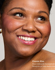 Close-up of a smiling woman with rosy lips and gold hoop earrings showcasing Glowify pH Lip Oil Tint Mood Ring Duo MX