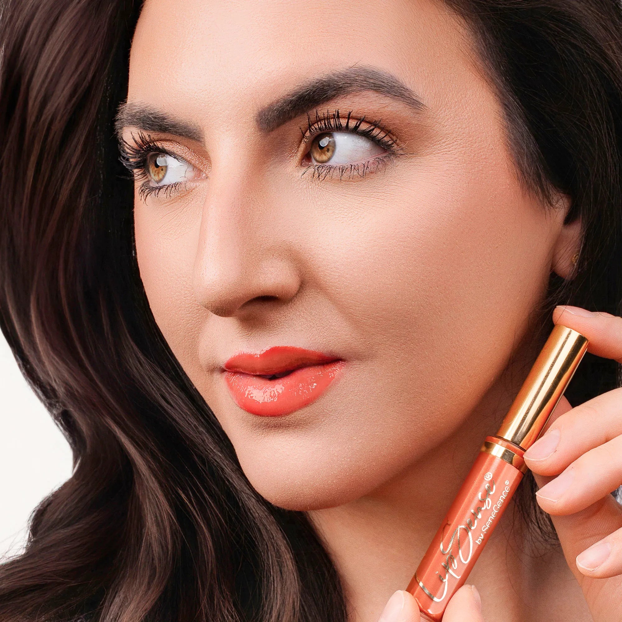 Model wearing LipSense Lip Color shade Coral Reef product