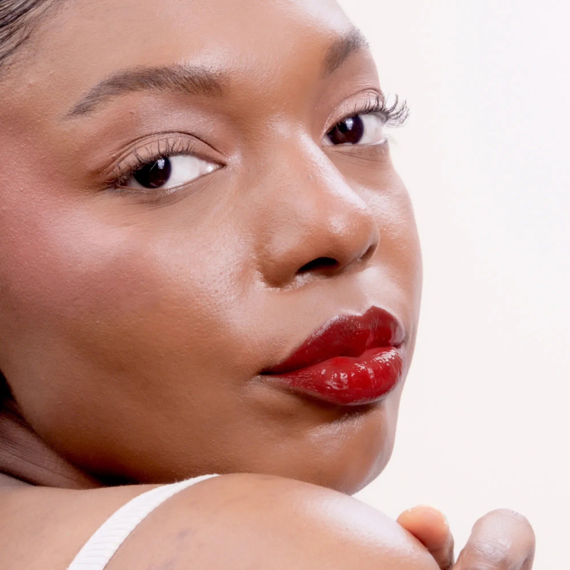 Model wearing LipSense Lip Color shade Fire product
