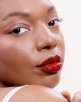 Model wearing LipSense Lip Color shade Fire product