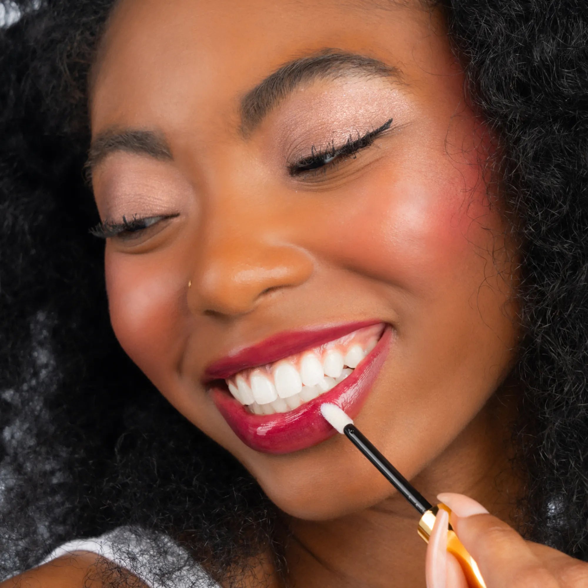 Model wearing LipSense Lip Color shade Plum product