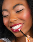 Model wearing LipSense Lip Color shade Plum product