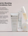 Barrier boosting microbiome care set with cleanser booster serum and night cream displayed against a soft pastel background