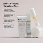 Barrier boosting microbiome care display with four skincare products arranged left to right a cleanser tube a serum bottle a moisturizer bottle and a cream jar on a soft gradient backdrop