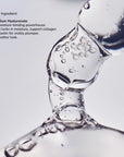 Close up of a stream of clear liquid with bubbles against a light background highlighting Sodium Hyaluronate as the key ingredient