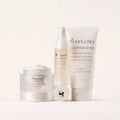 SeneGence Microbiome Regimen Set MX with cream in a jar serum bottle and cleanser tube on a pale background