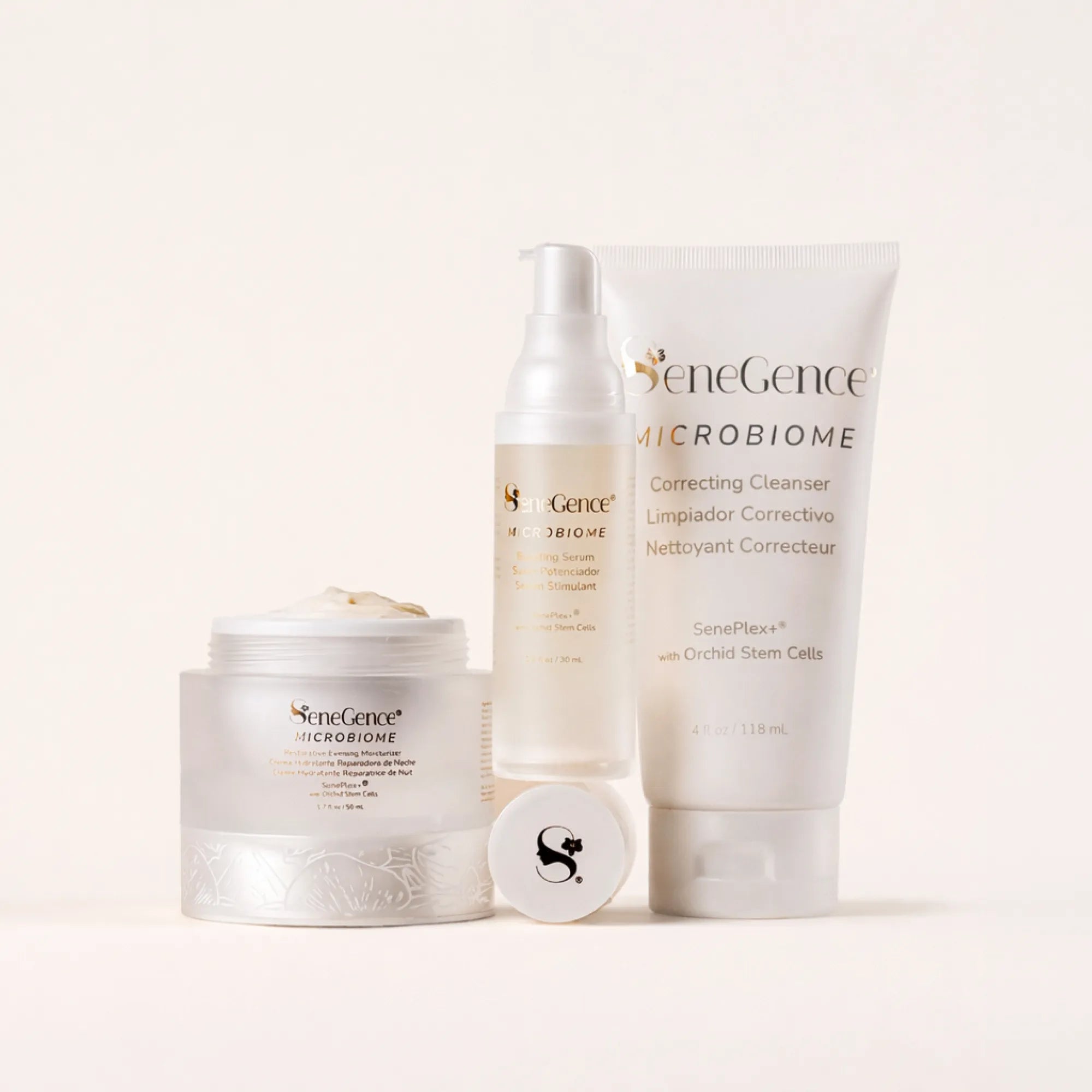 SeneGence Microbiome Regimen Set MX with cream in a jar serum bottle and cleanser tube on a pale background