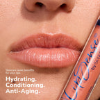 Close up of glossy lips with a LipSense gloss tube beside them showing a peachy shade