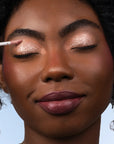 Model wearing ShadowSense product shade Sand Dollar Glitter
