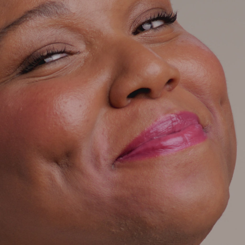 Application video of model putting on Glowify® pH Lip Oil Tint shade Cosmic Kiss.