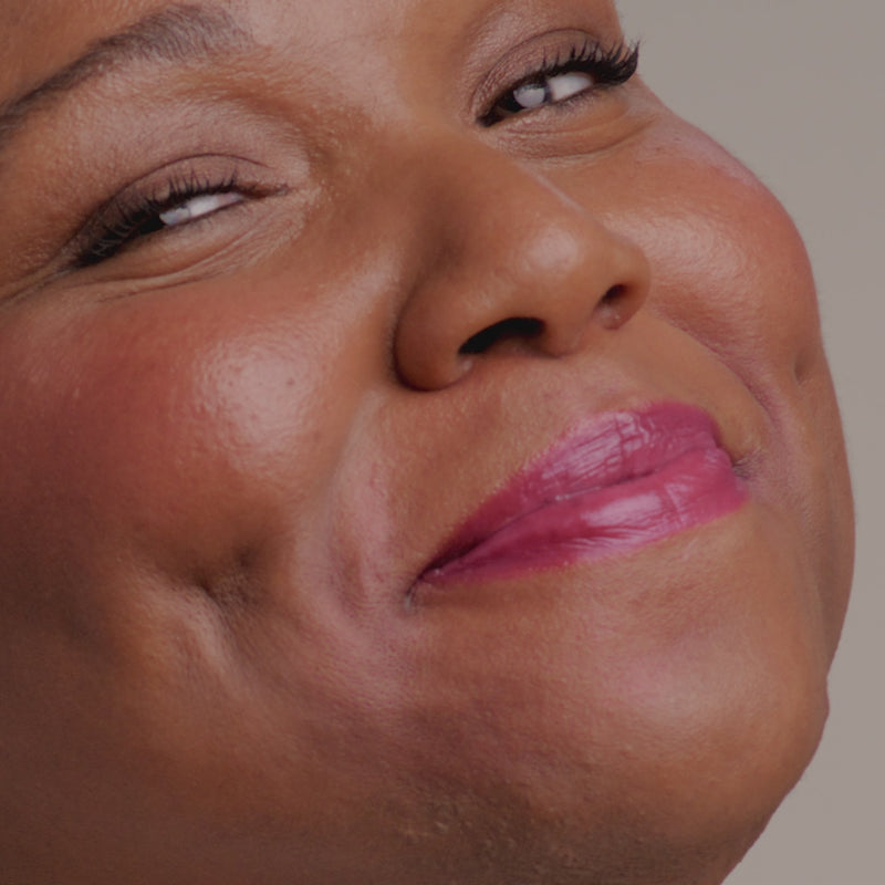 Application video of model putting on Glowify® pH Lip Oil Tint shade Cosmic Kiss.