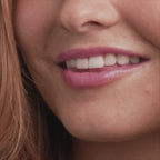 Application video of model putting on Glowify® pH Lip Oil Tint shade Mood Ring.